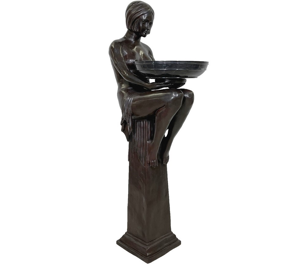 Bring timeless elegance into your home with the Bronze Art Deco Lady Holding Marble Bowl Sculpture, a striking fusion of classic craftsmanship and sophisticated design. This substantial statement piece embodies the grace, geometry, and glamour of the Art Deco era, making it an unforgettable focal point in any refined interior.