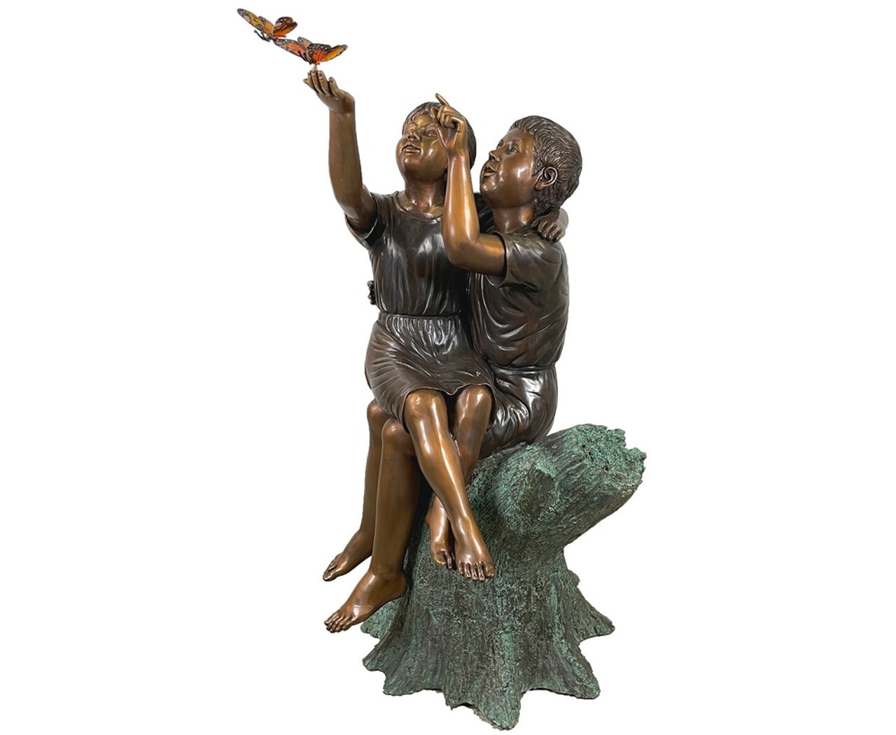 This stunning bronze sculpture features two children sitting on a tree stump while admiring a pair of beautiful monarch butterflies