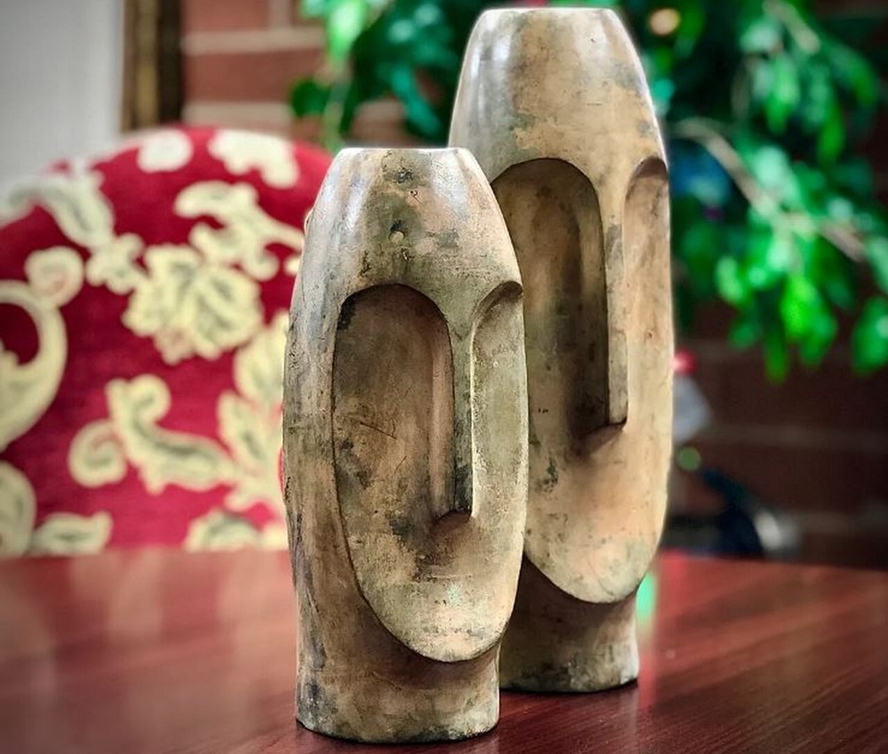 This pair of bronze contemporary face vase sculptures is perfect as a standalone display or to feature your floral creations.