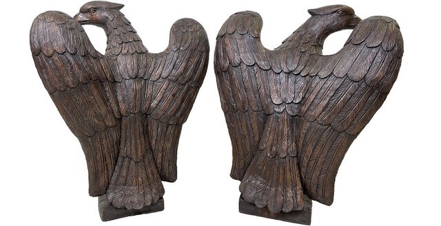 This bronze sculpture set features two eagles sitting on a ball. Notice the care taken to render each feather on the raptors. 