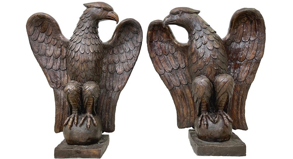 This bronze sculpture set features two eagles sitting on a ball. Notice the care taken to render each feather on the raptors. 
