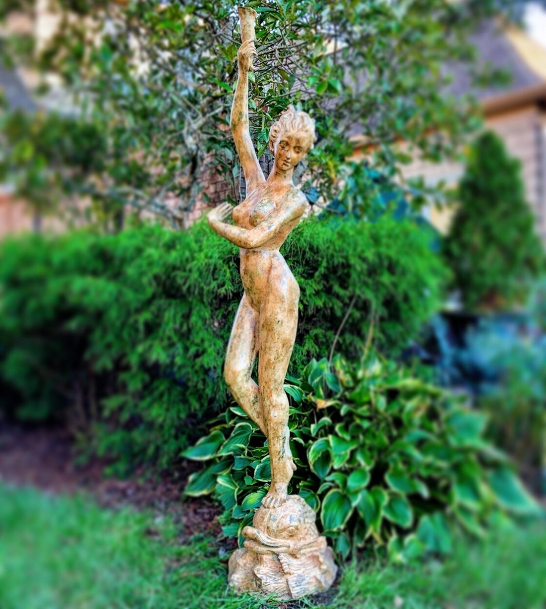 The Bronze Lady Holding Shell Fountain Sculpture is a testament to the enduring allure of classical artistry. This exquisite piece, standing at an impressive 6.5 feet tall, is a celebration of both form and function. 