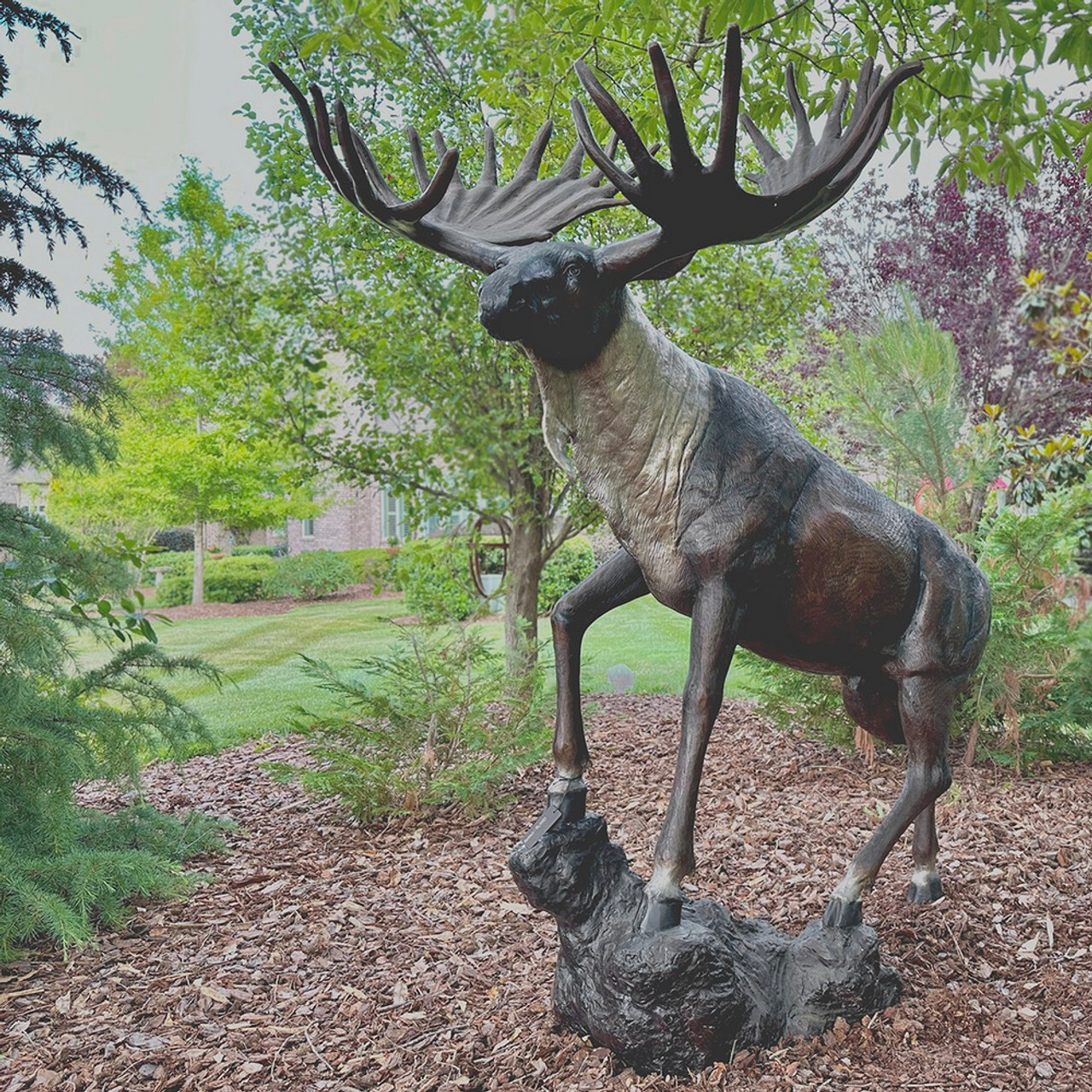 The Life-Size Bronze Moose Sculpture is a testament to the fusion of art and nature, standing as a majestic tribute to the wilderness.