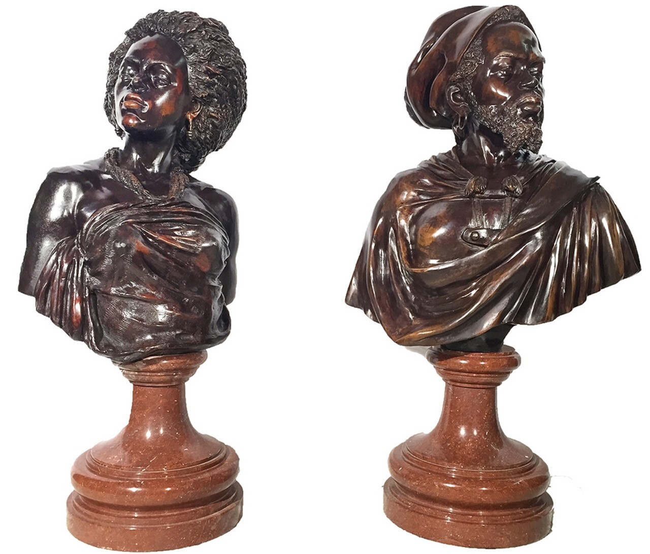 This bronze blackamour male and female sculpture set features a beautiful fire-applied brown patina and sits on a marble base.