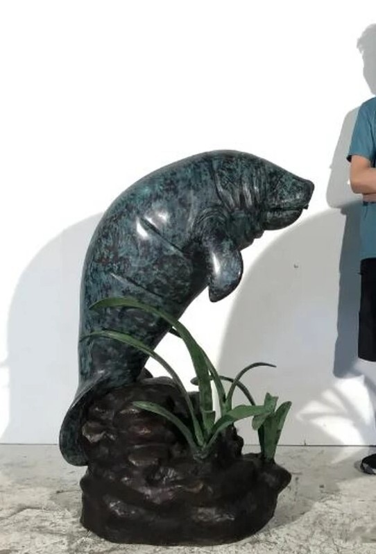 Enhance your space with the enchanting Bronze Manatee Fountain Sculpture. This exquisite piece is cast using the traditional Lost Wax Bronze Casting method, ensuring pristine quality and vivid detail.