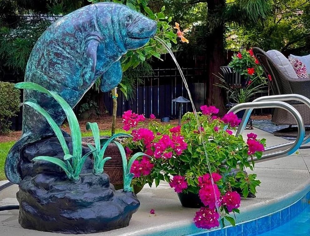 Enhance your space with the enchanting Bronze Manatee Fountain Sculpture. This exquisite piece is cast using the traditional Lost Wax Bronze Casting method, ensuring pristine quality and vivid detail.
