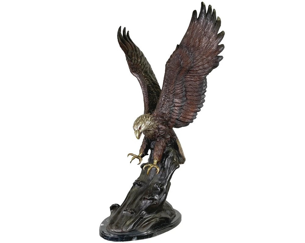 This medium bronze tabletop sculpture features a bald eagle with claws open ready to pounce on an unsuspecting prey.