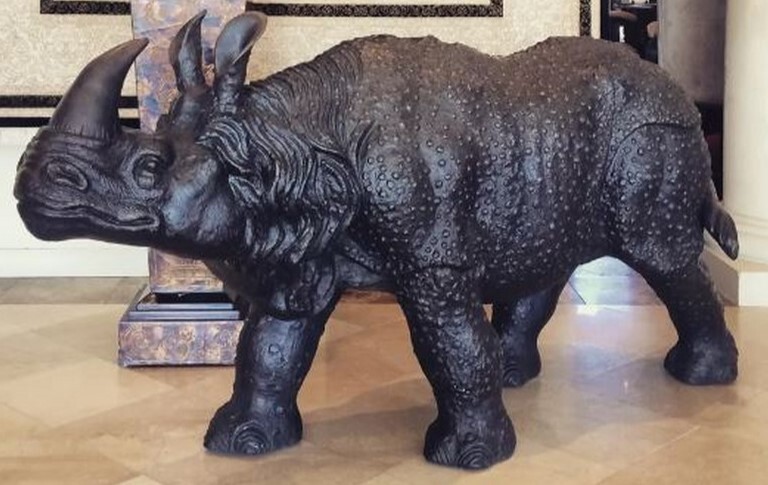 Rhinoceros Bronze Sculpture: A Powerful Statement of Strength, Craftsmanship & Natural Majesty This large bronze sculpture features a beautiful life-like rhinoceros. The traditional, labor-intensive lost wax bronze casting method used to create the statue ensures outstanding quality and true-to-life details.