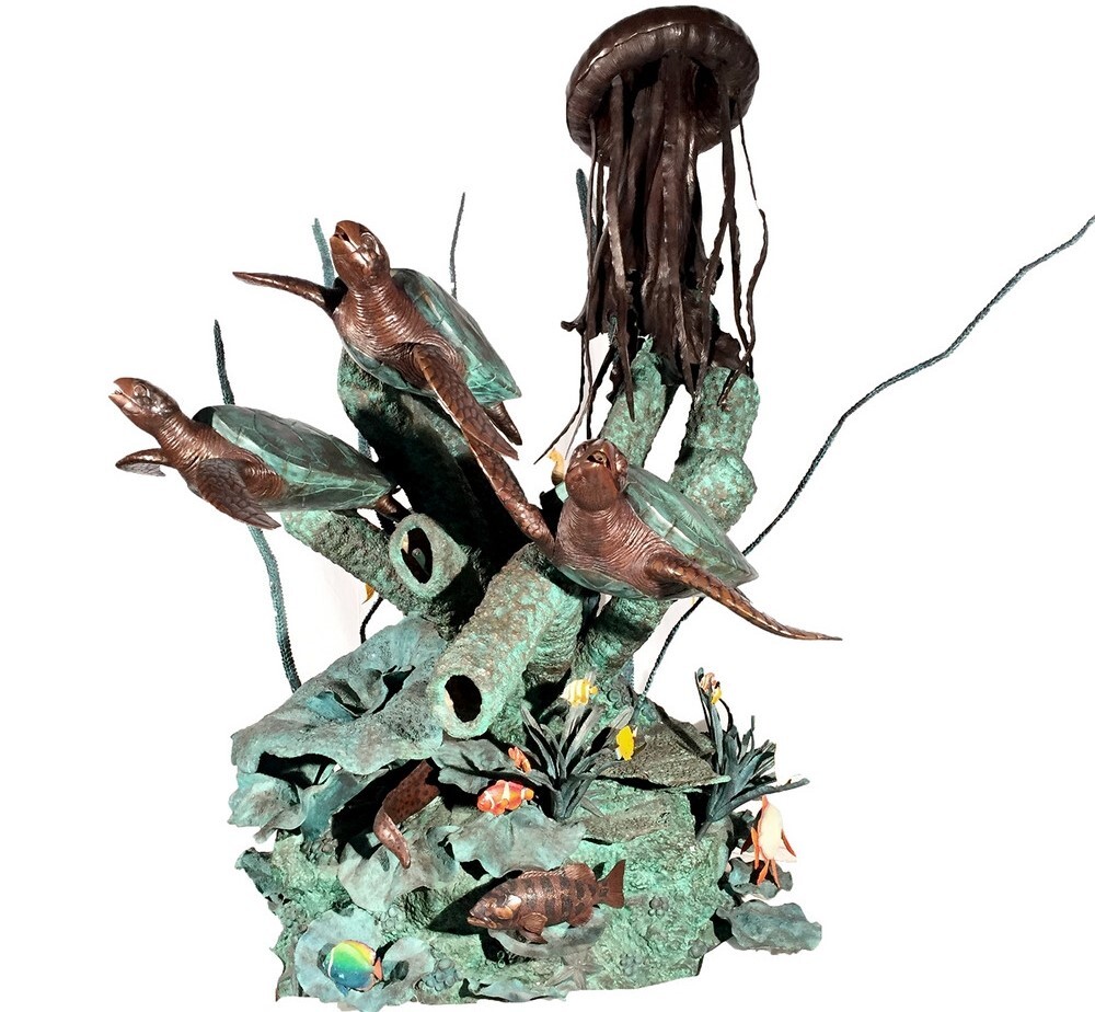 This vivid bronze fountain sculpture features three sea turtles, a jellyfish, and other sea life swimming among ocean flora.