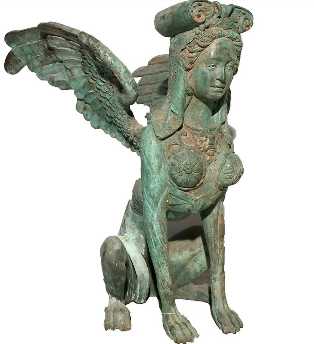 This bronze table base features a highly-detailed intricate sculpture of a sitting sphinx with a beautiful verdigris patina.