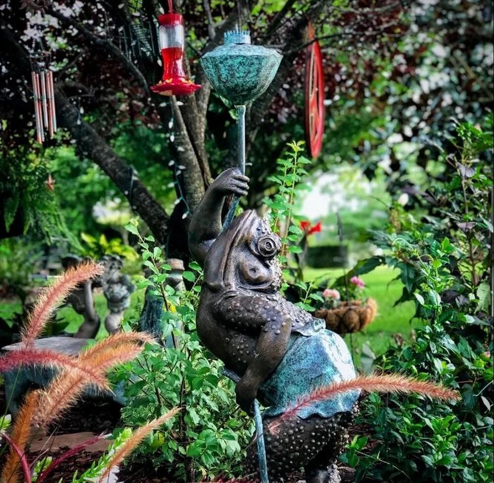 Add a touch of whimsy to your garden with the Bronze Whimsical Frog Fountain Sculpture. 