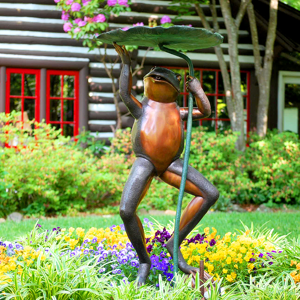 Introducing our charming Bronze Frog Holding Lily Pad Fountain, perfect for adding a whimsical touch to any outdoor space.